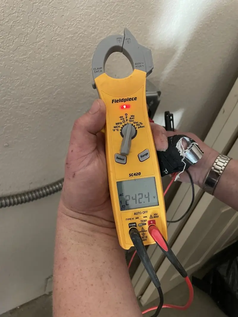 Voltage testing with clamp meter during Electrical Installation Services in White Pigeon